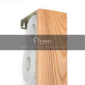 Vertical ashwood toilet paper holder with the Ewart Woods,showcasing its natural wood grain and stainless steel bracket.
