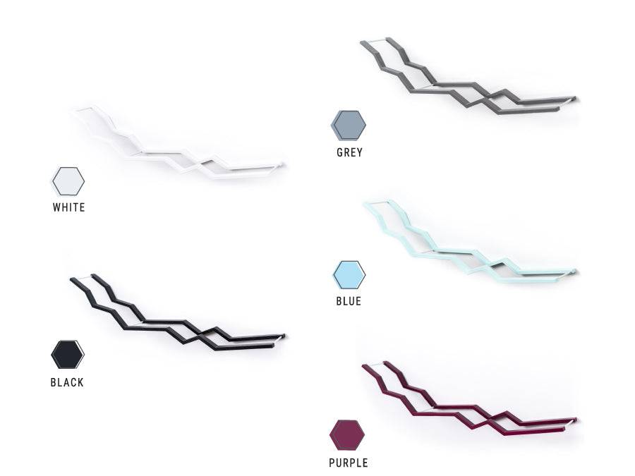 A selection of zigzag wall-mounted toilet paper holders in various colors: white, gray, blue, black, purple option.
