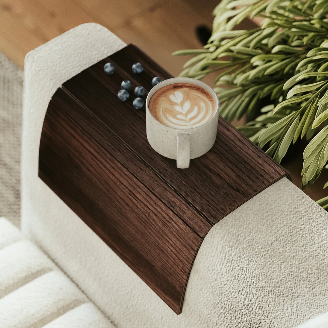 dark brown sofa arm tray on couch armrest with coffe cup and blueberries on