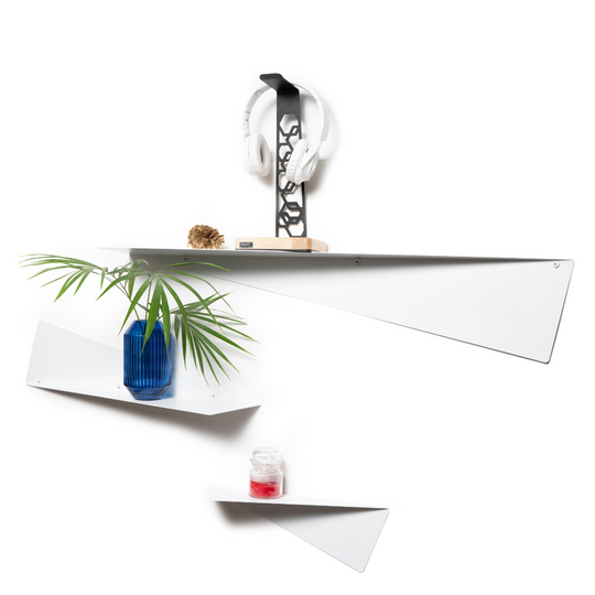 Set of triangular perforated wall shelves arranged decoratively, featuring a blue vase with greenery, a headphone stand, and a small candle, combining functionality with elegant design.