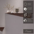 Rustic metal decor shelf with an angular design, featuring a decorative plant, smooth stones, and a black statue. Overlaid text highlights the product&