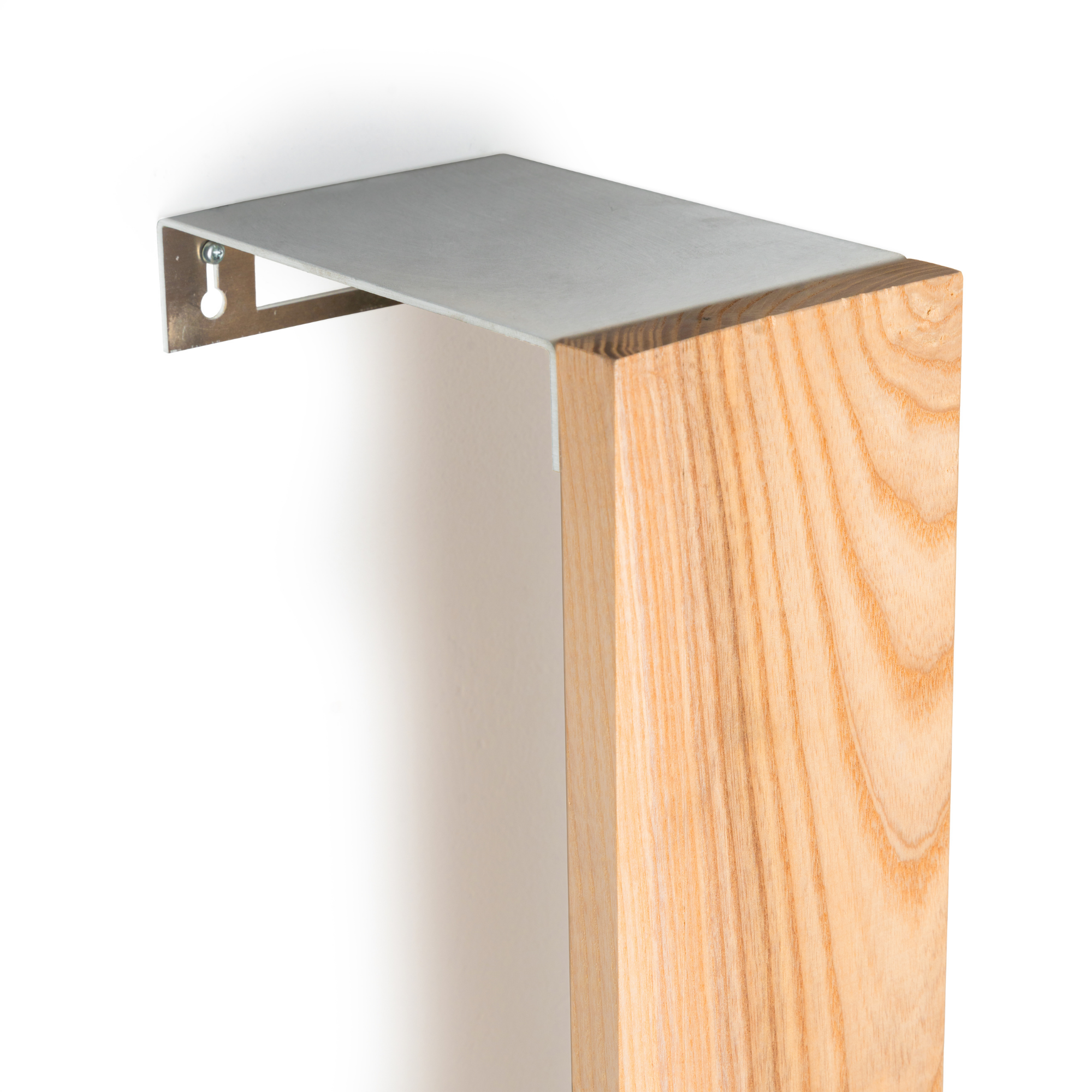 Close-up of a wall-mounted ashwood toilet paper holder with a stainless steel bracket, showcasing its modern and minimalist design.