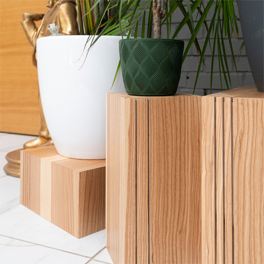 Different vertical groove designs for wood cube plant stands