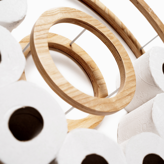 Close-up of small wooden circle toilet paper holder