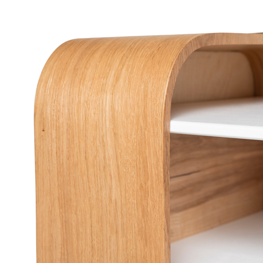 Close-up of wooden coffee table edges and white shelves