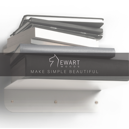 White metal floating shelf with golden screws and round corners by EWART WOODS