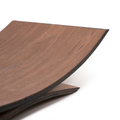 Close-up of the curved wooden holder, highlighting its texture and smooth finish, isolated on a white background.