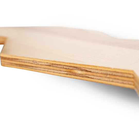 Close-up of the edge of a wooden shelf, highlighting its layered construction and smooth finish. The image shows the natural grain and texture of the wood.