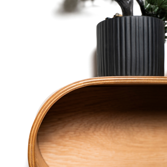 Floating wall display shelf with closed back curved edge design close up