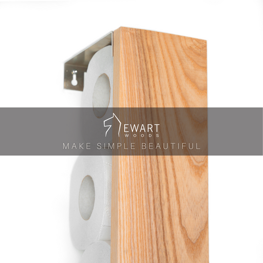 Vertical ashwood toilet paper holder with the Ewart Woods,showcasing its natural wood grain and stainless steel bracket.