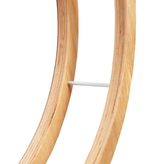 Close-up of the metal bar support in a wooden half-circle toilet paper holder, highlighting the smooth wood texture.