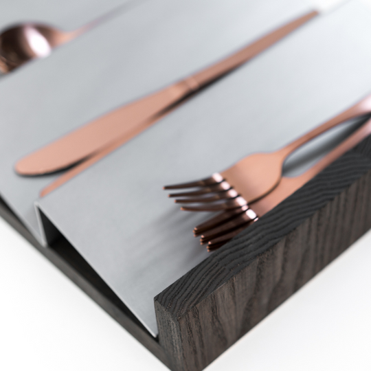 Close-up of wooden kitchen organizer with metal design
