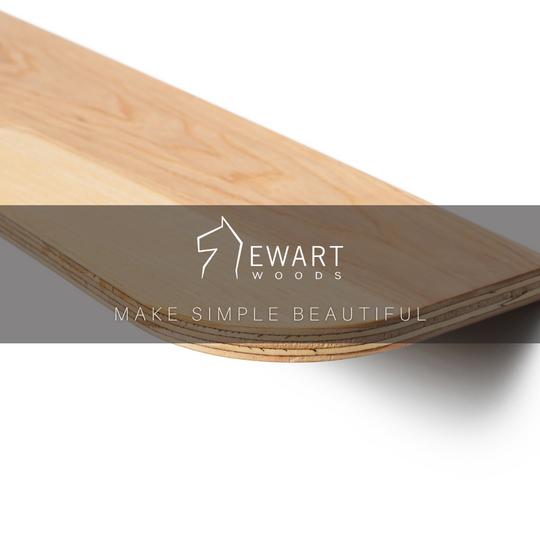 Close-up of a wooden shelf with a rounded edge, featuring a smooth, light wood finish. The image includes the Ewart Woods logo and the slogan "Make Simple Beautiful" displayed across the center.