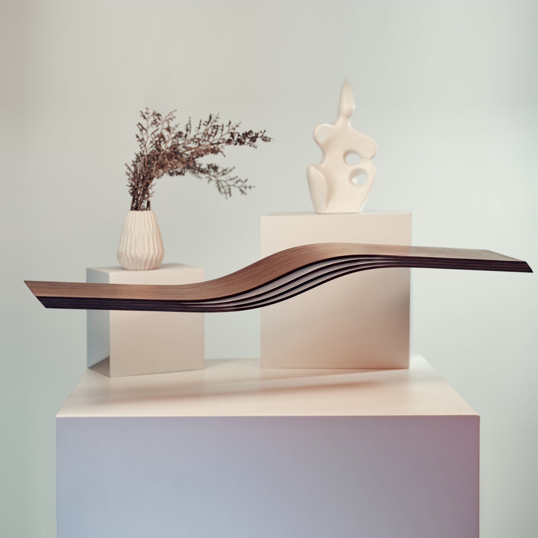 Wood curved floating wall shelf in walnut color with white interior 