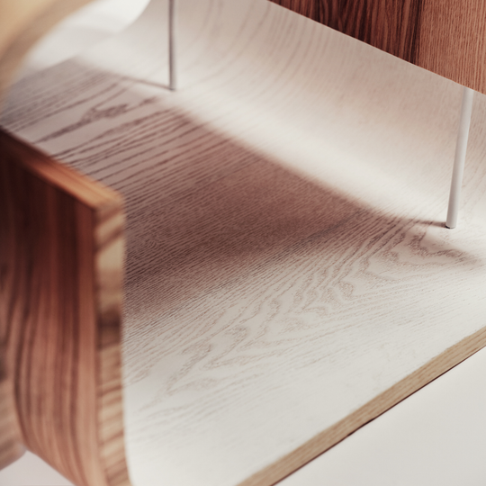 Close up of small round living room coffee table from wood with modern design