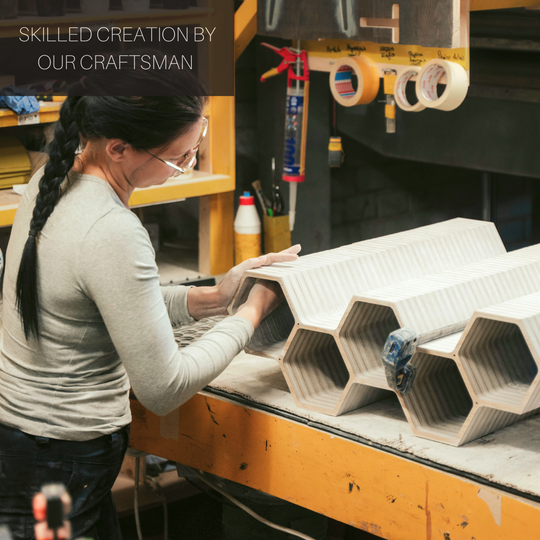 EWART WOODS craftswoman working on wooden items in workshop
