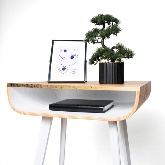 Close-up of wooden floating nightstand with brass design and white wooden legs