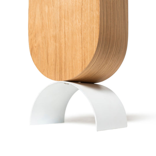 Close-up of a wooden umbrella holder white metal leg attached by screws