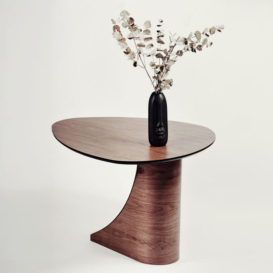 Rear view of modern round wooden coffee table with brass design on the front of the wooden base