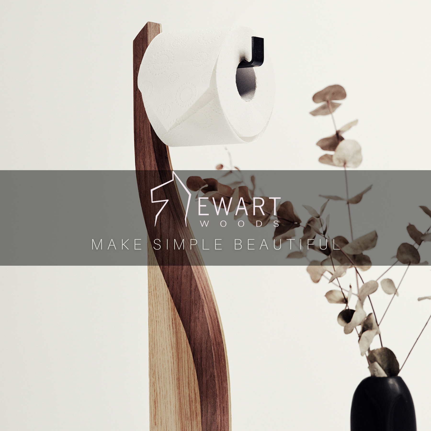 Wooden standing toilet paper holder in ashwood with walnut color detail and metal holder made by EWART WOODS