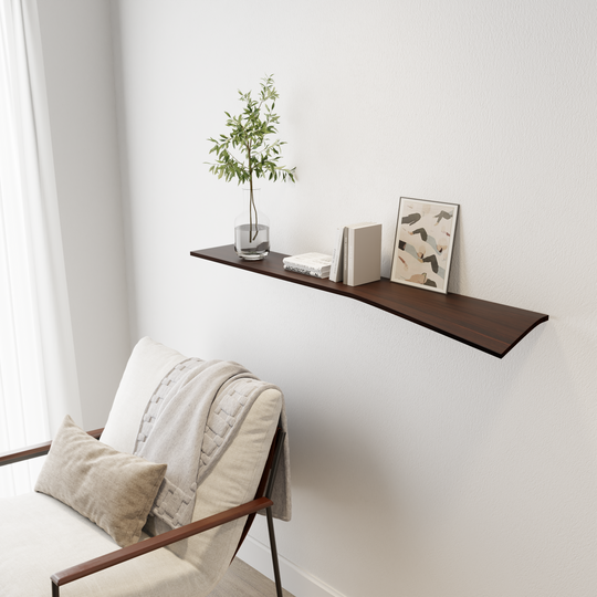 floating wall shelf with curved edge dark wood attached to white wall with books, vase and painting on the shelving