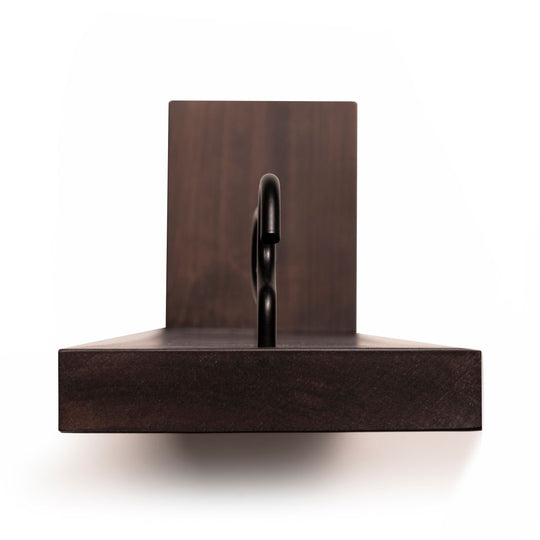 Front view of a dark-stained wooden mug holder, highlighting the sturdy metal hook and solid base construction.