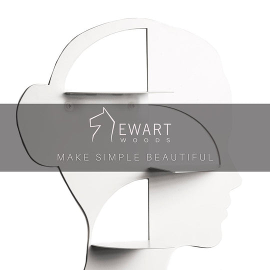 Face-shaped wall shelf with the EWART WOODS logo and slogan &