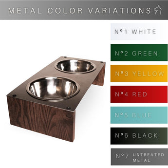 Raised dog feeder with a metal surface and wooden base, holding two stainless steel bowls. The metal top comes in seven different finishes: white, green, yellow, red, blue, black, and raw metal.