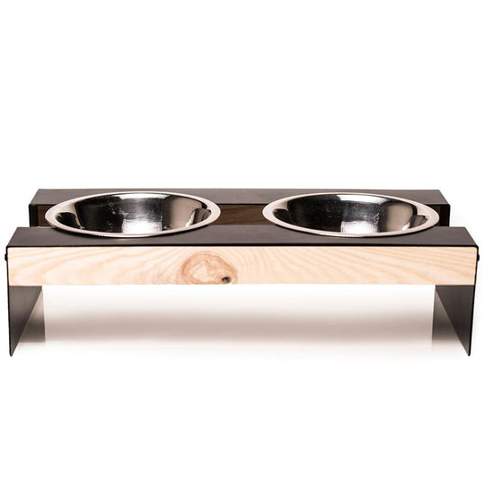 Stainless steel dog bowls in a sleek metal frame with smooth wooden accents. Elevated design for easy access.