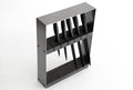 Angled view of a sleek, modern knife block featuring a black metal frame and dark wooden insert, holding six black-handled knives in evenly spaced horizontal slots.