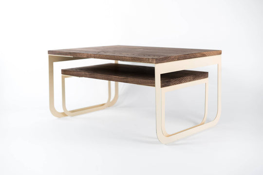 Modern wooden tray set featuring warm wood surfaces and sleek ivory metal legs, designed for versatile use in small spaces.