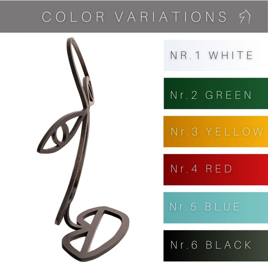 Abstract face-shaped glasses stand with six color variations displayed: white, green, yellow, red, blue, and black. The stand is shown in a side view with the listed color options.