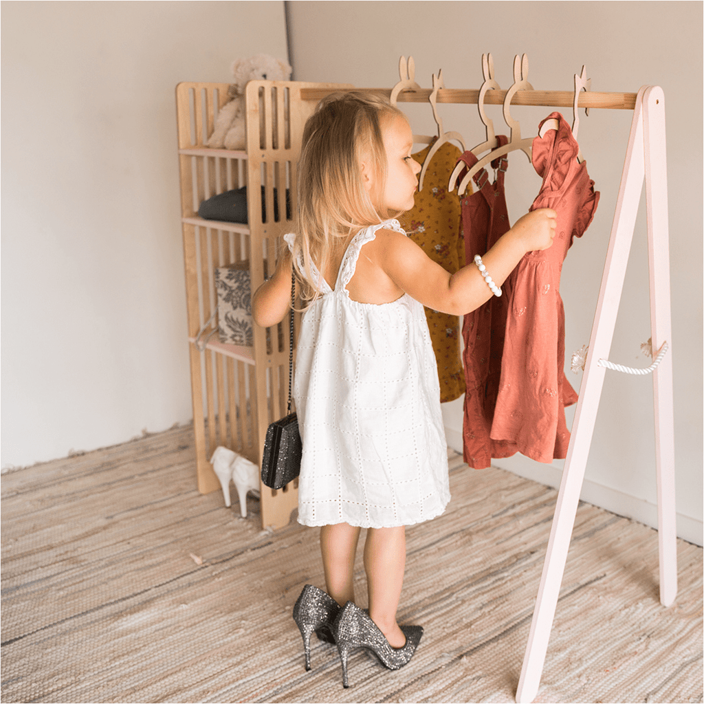 https://ewartwoods.com/cdn/shop/products/ewart-woods-design-triangle-pikler-kids-wooden-clothing-rack-29944406736930_1024x1024.png?v=1660611448