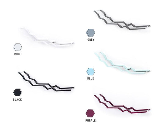 A selection of zigzag wall-mounted toilet paper holders in various colors: white, gray, blue, black, purple option. 